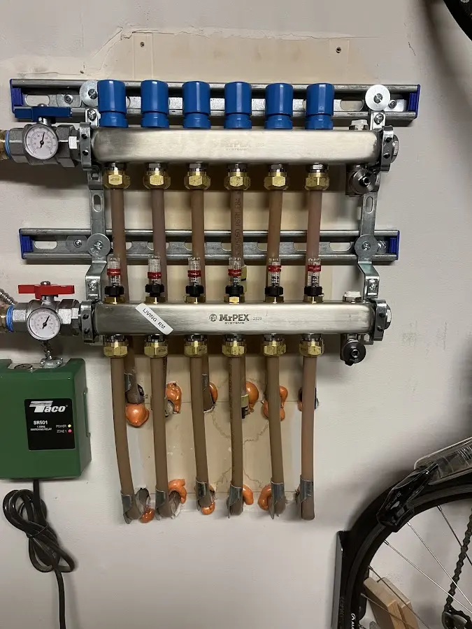 Plumber performing Gas Line Installation at a residential property in Ghent